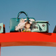 Pictured are bags featuring No Face and Chihiro from Spirited Away.